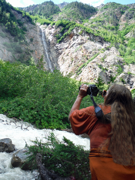 Karen Duquette in front of the waterfall